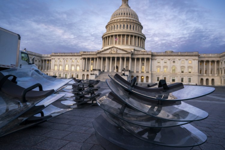 Riot shields are stacked at the ready as National Guard troops reinforce the security zone on Capitol Hill in Washington on Tuesday before President-elect Joe Biden is sworn in as the 46th president on Wednesday. 