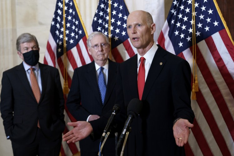 Sen. Rick Scott, R-Fla., joined at center by Senate Majority Leader Mitch McConnell, R-Ky., and Sen. Roy Blunt, R-Mo., speaks to reporters Nov. 10. 

