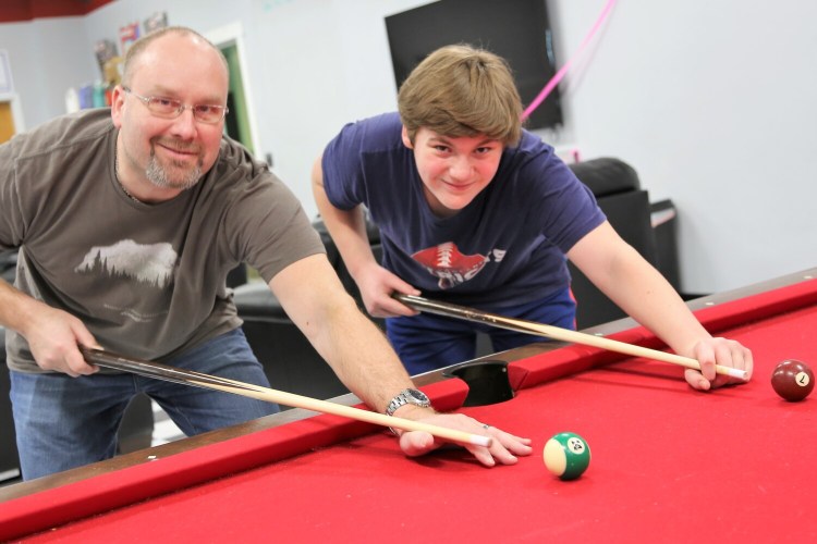 Big Brother Chris Paradis, left, and his Little Brother Evan Jones enjoy playing cribbage, watching movies and, shown here two years ago, shooting pool. Chris and Evan were matched three years ago as part of Big Brothers Big Sisters of Mid-Maine, which is actively recruiting adults in the community, as well as college and high school students, to become Bigs to one of 100 kids waiting to be matched. To learn more about becoming a BBBSMM mentor, call 207-236-BBBS (2227) email info@bbbsmidmaine.org or visit bbbsmidmaine.org.