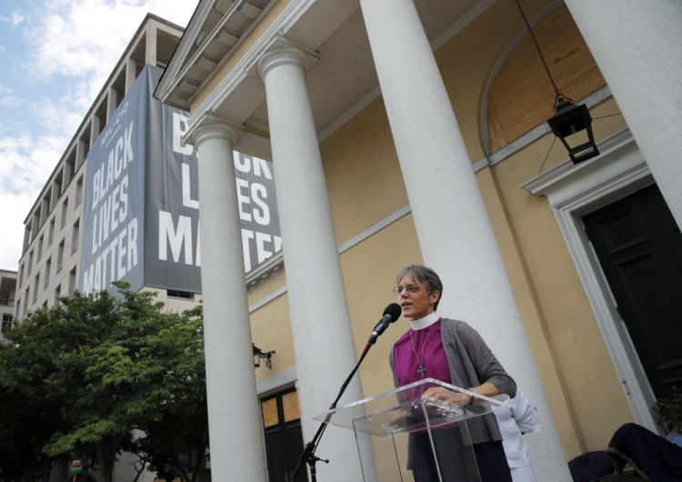 The Rev. Mariann Budde, bishop of Washington’s Episcopal diocese, speaks during a service outside St. John's Episcopal Church near the White House in Washington on June 19. Budde is among more than 2,000 faith leaders and faith-based activists who signed a statement  urging members of Congress “to honor” the result of November’s election by avoiding “a delayed and drawn out objection” on Wednesday, Jan. 6 when President-elect Joe Biden’s win is set to be certified. 
