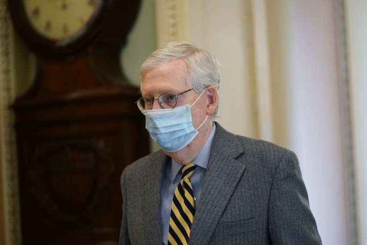 Senate Majority Leader Mitch McConnell of Ky., walks to the Senate floor Dec. 30 on Capitol Hill in Washington.