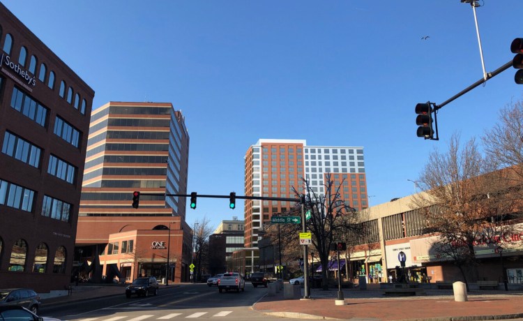 This digital rendering shows the planned 18-story apartment building, right of center. It will be taller than any building in Portland, including the 13-story One Center Center, at left of center in this image. 