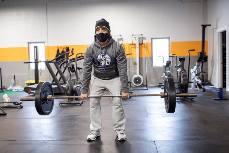 Tony Napolitano works out at Beyond Strength in Falmouth on Jan. 29. Napolitano joined the gym recently after working out at home and outdoors through most of the pandemic. "It was much harder to keep doing after it got cold," he said. "I'd much rather come to a gym."