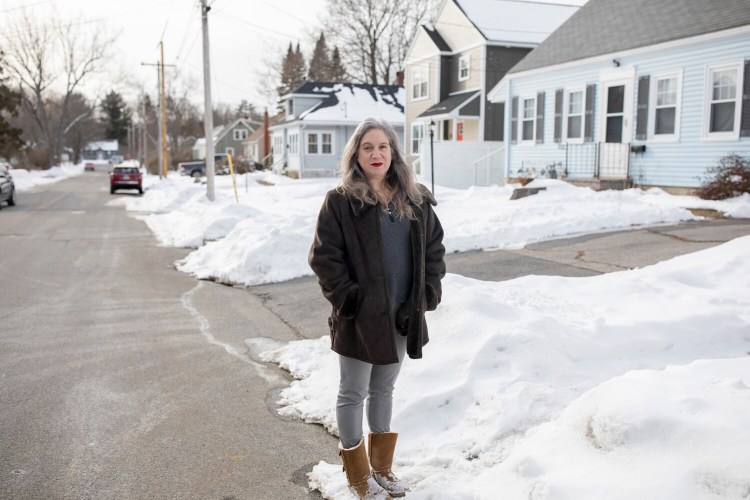 Celia Mantovani stands outside her home in Portland on Feb. 12. Mantovani is a Brazilian psychiatrist who hasn't been able to work in her field since moving to Maine. She is one of thousands of foreign professionals struggling to use their skills in the U.S. because of education and licensing barriers.