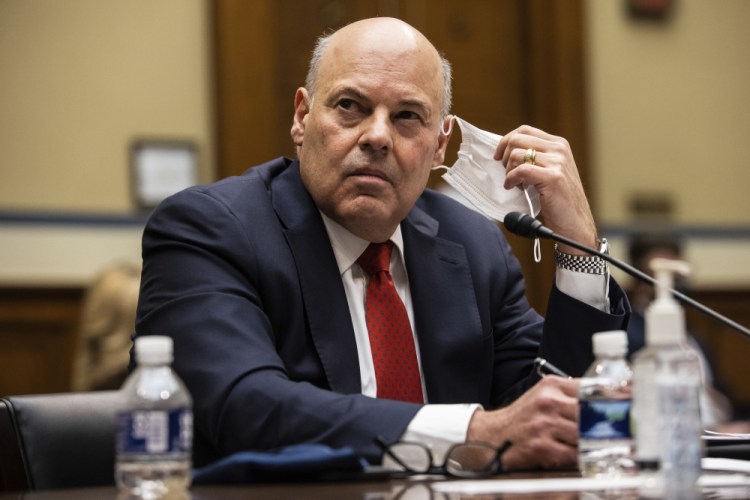 United States Postal Service Postmaster General Louis DeJoy looks on during a House Oversight and Reform Committee hearing on "Legislative Proposals to Put the Postal Service on Sustainable Financial Footing" on Capitol Hill, Wednesday, Feb. 24, in Washington. 