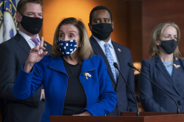 House Speaker Nancy Pelosi of Calif., with impeachment managers Rep. Eric Swalwell, D-Calif., Rep. Madeleine Dean, D-Pa., and Rep. Joe Neguse, D-Colo., speaks to members of the media during a news conference on Capitol Hill in Washington, after the U.S. Senate voted to acquit former President Donald Trump of inciting riot at U.S. Capitol, ending the impeachment trial, Saturday, Feb. 13. 