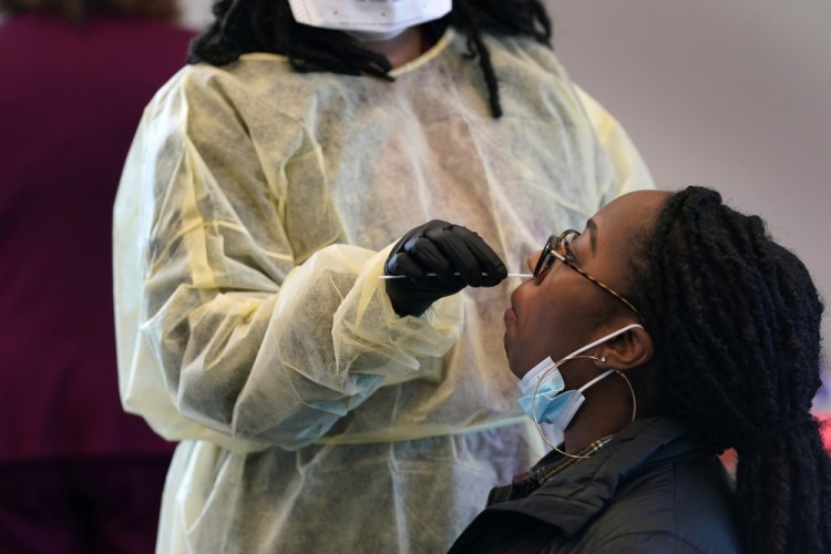 Jazmyn Finney is administered a coronavirus 15-minute rapid test at the student health center on campus at North Carolina Agricultural and Technical State University in Greensboro on Wednesday.


