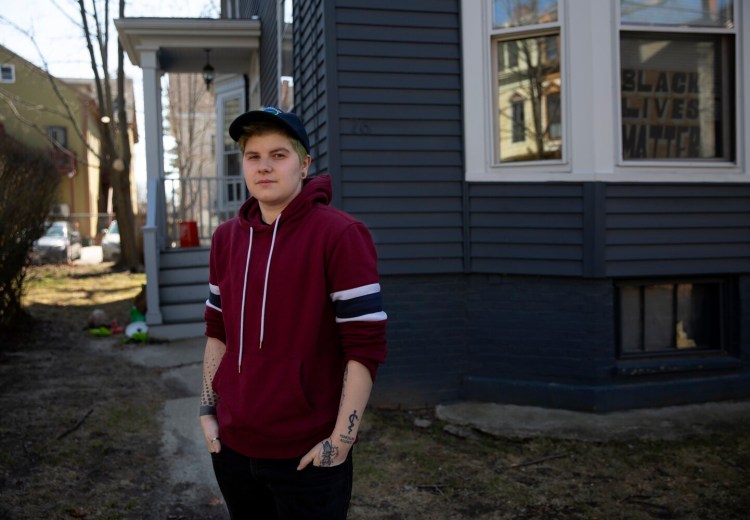 Ivan Zhaya stands outside an apartment building in Portland’s West End. Zhaya lost his job in December and recently was approved for rent relief, for $3,300 owed for the first three months of this year and the same amount to cover April, May and June rent. Now he can work at paying down $40,000 in student loans, build up savings and consider buying a car.