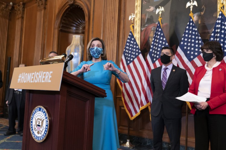 Speaker of the House Nancy Pelosi, D-Calif., joined at right by Rep. Raul Ruiz, D-Calif., chairman of the House Hispanic Caucus, and Rep. Lucille Roybal-Allard, D-Calif., discusses the upcoming vote on the American Dream and Promise Act of 2021, a bill to help reform the immigration system, at the Capitol in Washington on Thursday.