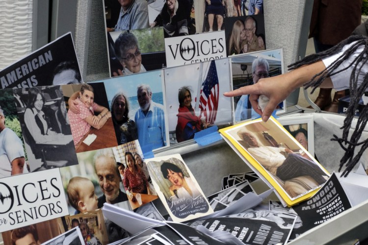 Families of COVID-19 victims who died in New York nursing homes gather Oct. 18 in front of Cobble Hill Heath Center in Brooklyn to demand Gov. Andrew Cuomo apologize for his response to outbreaks in nursing homes during the pandemic. 

