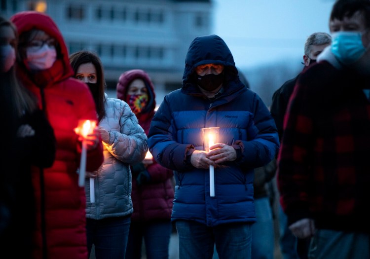 People gather at Friday's celebration of life for Rhonda Pattelena at York's Short Sands Beach.