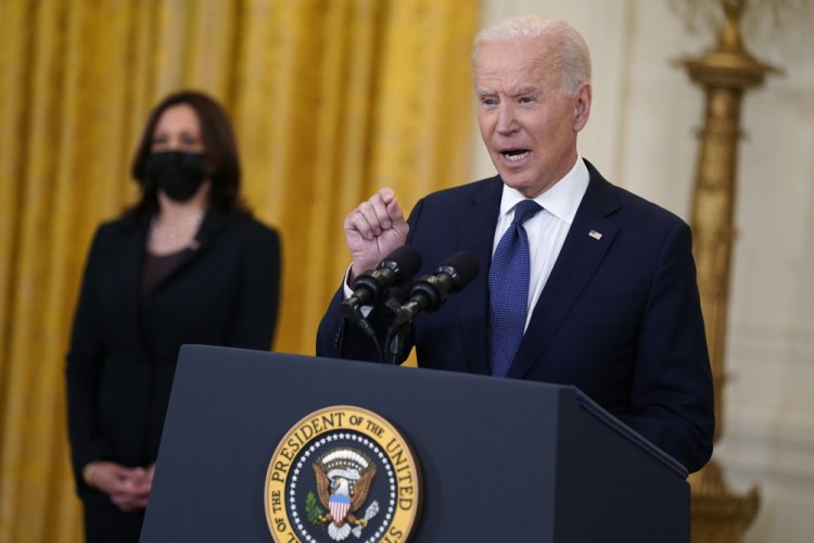 Vice President Kamala Harris listens as President Joe Biden speaks about the economy, in the East Room of the White House, Monday, May 10, in Washington. 