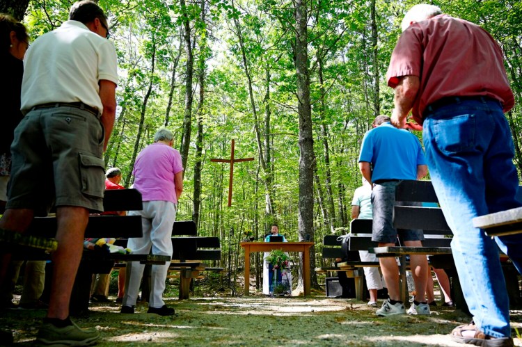 WINDHAM, ME - JUNE 13: Rev. Jane Field, pastor, of  Faith Lutheran Church leads the Sunday service at the chapel in the woods Sunday, June 13, 2021. (Staff Photo by Shawn Patrick Ouellette/Staff Photographer)