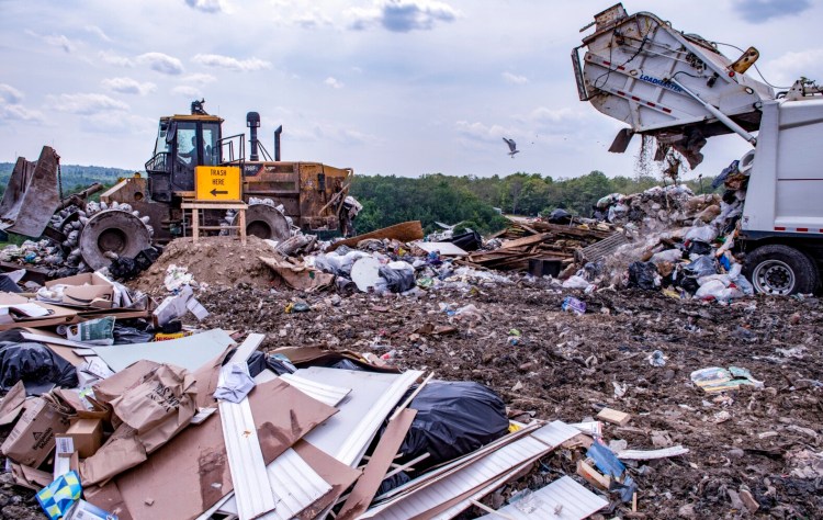 A garbage truck dumps a load in July 2021 at Hatch Hill landfill in Augusta. The city is considering increasing tipping fees for the landfill.