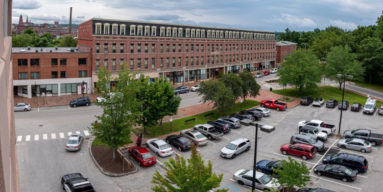 The municipal parking lot across from the Roak Block on Main Street in Auburn is one of several city parcels being marketed for possible development. City staff outlined a five-year downtown revitalization plan this week.