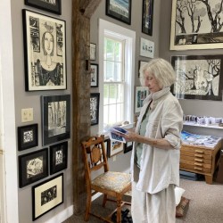 Deirdre Cavanagh, surrounded by her artwork