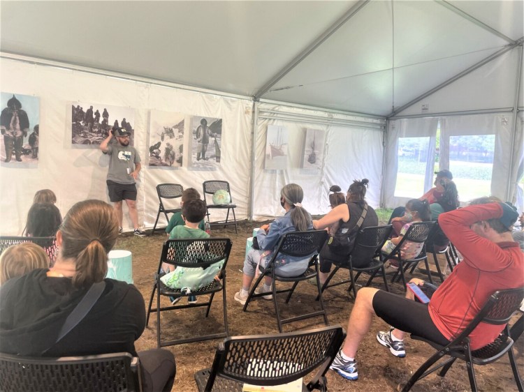 James Tanzer, an outreach coordinator of Peary-MacMillan Arctic Museum, during a story reading session on Saturday. 