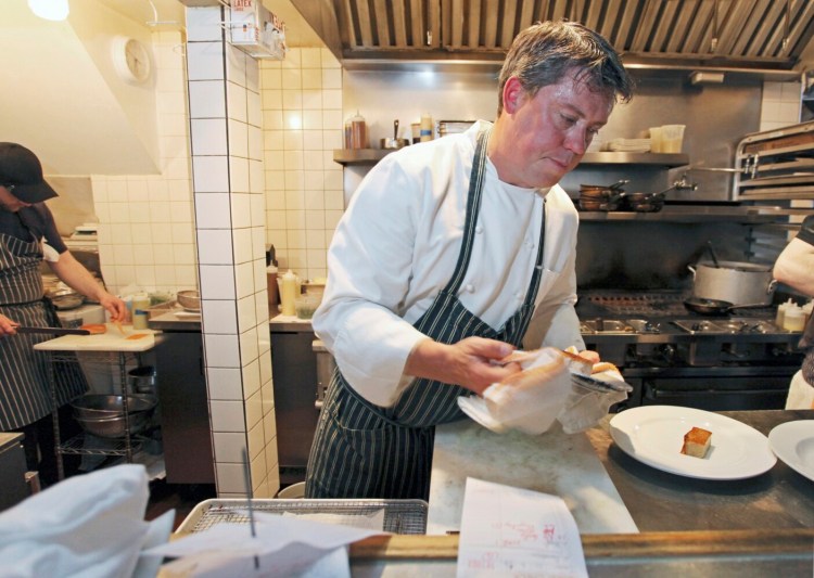 PORTLAND, ME - JUNE 3: Larry Matthews Jr., owner/chef at Back Bay Grill in Portland, plates food during a busy dinner hour. (Photo by Jill Brady/Staff Photographer)