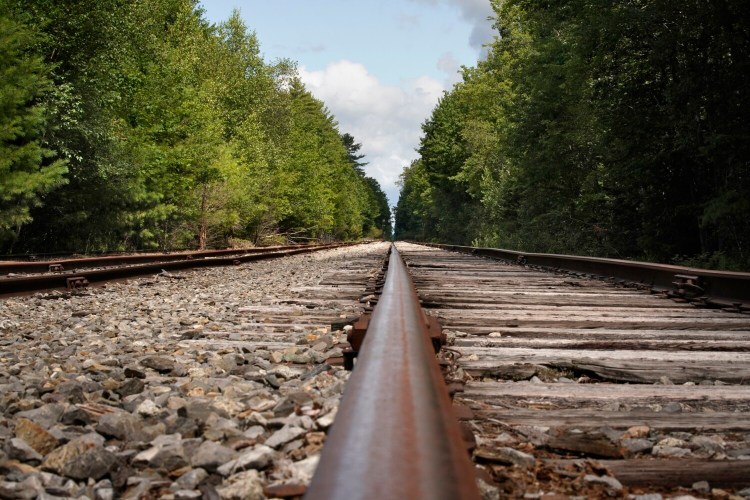 The tracks of the St. Lawrence and Atlantic Railroad near a trail crossing in the Riverfront Woods Preserve in Yarmouth could become a rail trail if an effort spearheaded by the Casco Bay Trail Alliance gains momentum.