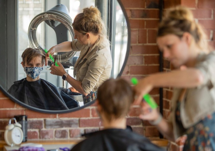 GORHAM, ME: AUGUST 06: Megan Wentworth, 17, wears a mask while having her hair styled by Gorham's Neu Du Salon owner Catherine Chase on Friday, August 6, 2021, 2021. Megan said she was wearing it because she was expected to wear one. Catherine said she leaves it up to the client. (Photo by Carl D. Walsh/Staff Photographer)