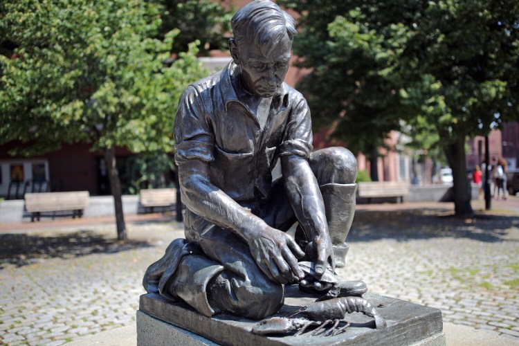 PORTLAND, ME - AUGUST 14: The lobsterman statue in the plaza near the Nickelodeon in Portland was modeled after H. Elroy Johnson, a lifelong fisherman from Bailey Island, who frequently visited the State House to advocate for Maine’s working fishermen and lobstermen. The original was commissioned to be in the Maine exhibit of the 1939 New York World's Fair. (Staff photo by Ben McCanna/Staff Photographer)