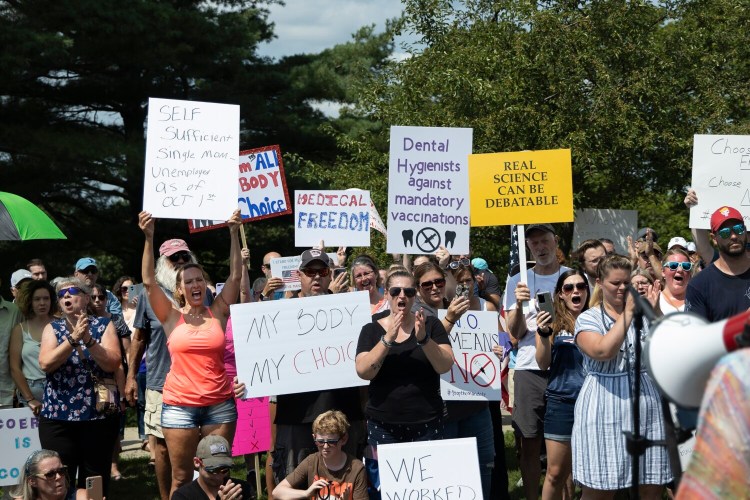 Protesters demonstrate on Aug. 14 near Maine Medical Center in Portland against the vaccine mandate for all health care workers that was announced by Gov. Janet Mills two days earlier. On Friday, The U.S. Supreme Court rejected an emergency appeal from health care workers to block the mandate.