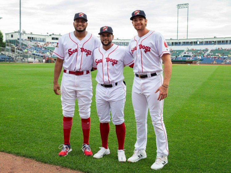 PORTLAND, ME - AUGUST 17: Portland Sea Dogs teammates Denyi Reyes, left, Roldani Baldwin and Triston Casas, right, competed in the Tokyo Olympic games, . (Staff photo by Derek Davis/Staff Photographer)