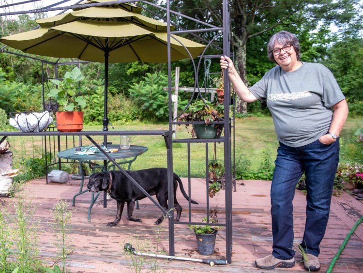 Annette Roy, an LPN, poses for a photo at her home in Lewiston. Roy , who works two days a week at Ledgewood Nursing Home in Windham, says she will fully retire instead of taking the COVID-19 vaccine.