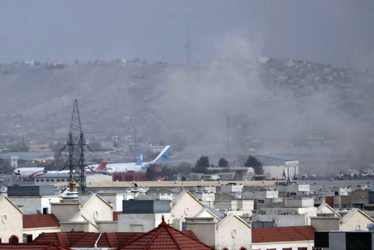 Smoke rises from a deadly explosion outside the airport in Kabul, Afghanistan, on Thursday. 