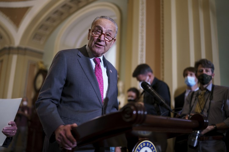 Senate Majority Leader Chuck Schumer, D-N.Y., speaks to reporters at the Capitol in Washington on Tuesday. 