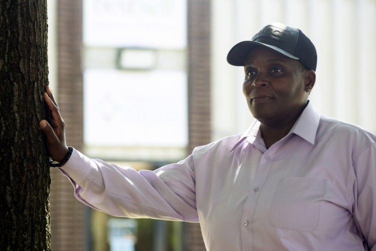 Mona Lisa McEachin stands outside of BestSelf Behavioral Health in Buffalo, N.Y. McEachin is a peer mentor at BestSelf Behavioral Health and is currently working to train other peer mentors to work with people in recovery. She said she found her life's calling being a mentor to others struggling with addiction. 