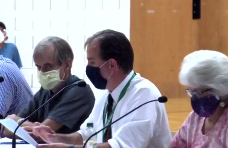 Regional School Unit 38 Superintendent Jay Charette, center, speaks Aug. 30, 2021, during an emergency school board meeting to discuss overturning the previous mask policy. On Wednesday night, Charette said it would not be a good idea to lift universal masking at this time. A motion to keep the mask mandate in place was approved, 8-3.