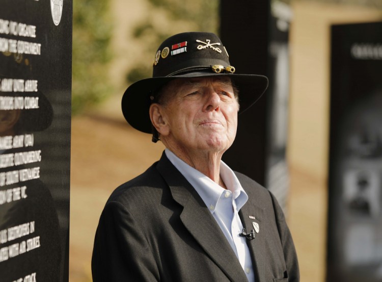 Joseph Galloway talks to reporters after services for retired Lt. Gen. Hal Moore at Fort Benning, Ga., in 2017.