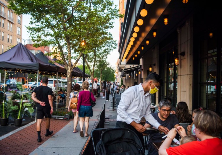 WASHINGTON, D.C. - JULY 9: Patrons dine outdoors at The Smith on U St. on Friday, July 9, 2021 in Washington, D.C. (Photo by Amanda Voisard/for The Washington Post)