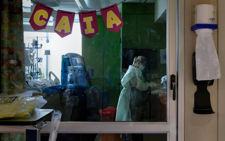 Nurse Brittany Rowell washes up in the pediatric ICU at Arkansas Children's Hospital Aug. 9. "These kids are the strongest people I've ever met," she says. MUST CREDIT: Washington Post photo by Michael S. Williamson