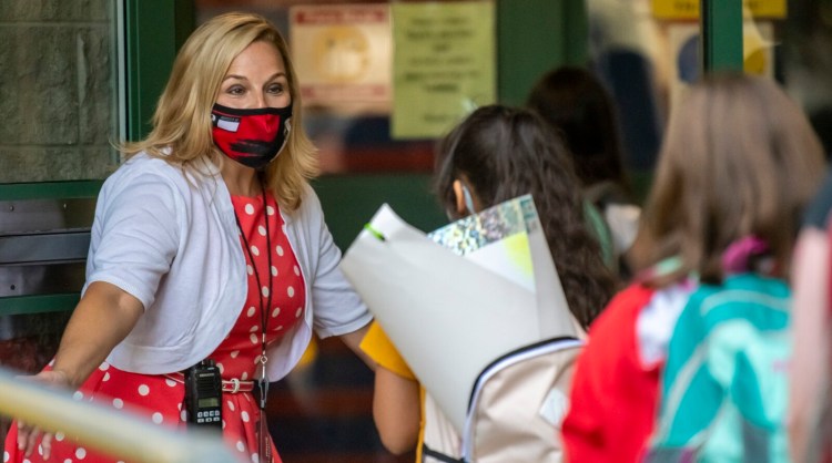 Principal Heather Gauthier welcomes students last Wednesday on the first day of school at Lincoln Elementary School in Augusta.