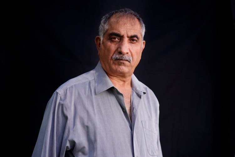 PORTLAND, ME - AUGUST 31: Yasin Ahmady, an Afghan who lived in Portland when the Septemnber 11 attacks occurred, returned to Afghanistan in 2002 to work with U.S. troops stationed there. He worked in Afghanistan until 2011, when an improvised explosive device blew up the humvee he was riding in, injuring himself and the soldiers he was with. (Staff photo by Gregory Rec/Staff Photographer)