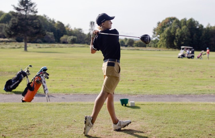 Freeport High sophomore Eli Spaulding tees off at the third hole during a match Tuesday at Freeport Country Club.