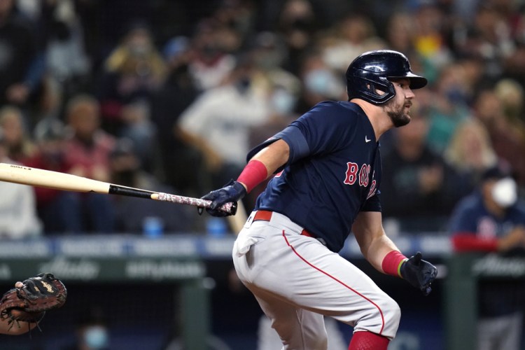  Kyle Schwarber of the Boston Red Sox watches his three-run double against the Seattle Mariners during the eighth inning Tuesday, Sept. 14, 2021, in Seattle. 
