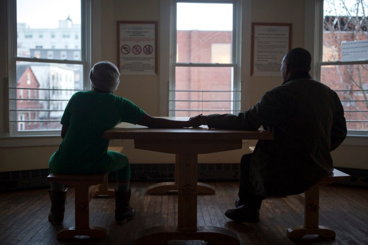 Matare, right, and his wife at the family shelter where they are staying in December 2018. Housing advocates say well over 300 asylum seekers have arrived in recent weeks and have been placed in hotels in Portland, South Portland and elsewhere in Greater Portland.
