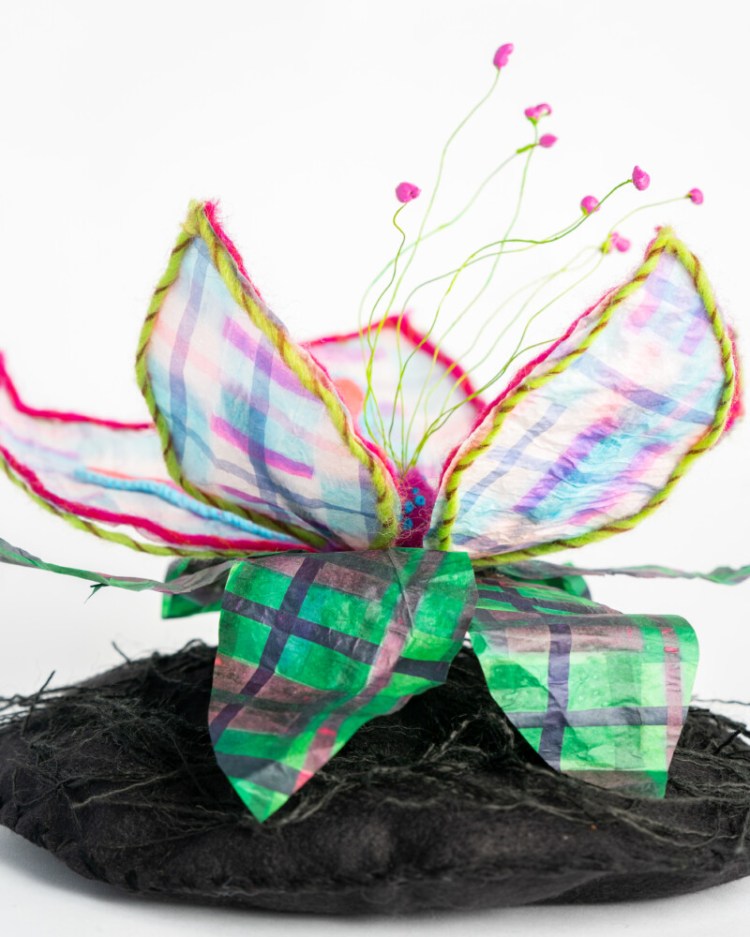 Juliet Karelsen, "Plaid Lotus," assorted fiber under glass dome, 14” high, 12” diameter, 2021.
