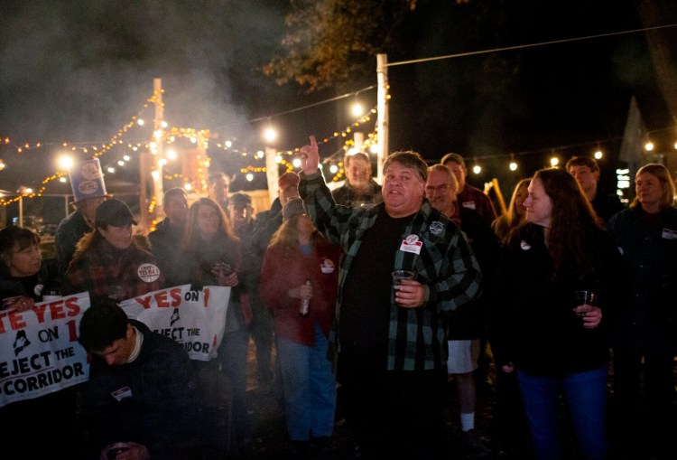 Volunteer Darryl Wood of New Sharon speaks at a Yes on 1 watch party Tuesday night at Farmhouse Beer Garden in Farmington. Voters rejected the NECEC project Tuesday by voting "yes" on Question 1.