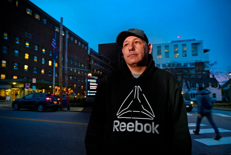 Andrew Lerman Jr. stands outside Maine Medical Center in Portland, where he was visiting his mother Monday.