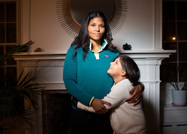 YARMOUTH, ME - DECEMBER 8: Kellie Hall, a mother of three young children, noticed that her kids had signs of depression because of the pandemic after moving to Maine in 2020. She was proactive in having her son see a school counselor and she enrolled her daughter in gymanstics so she could form connections with other kids. Kellie is pictured with her eight year-old daughter Frannie. (Photo by Derek Davis/Staff Photographer)