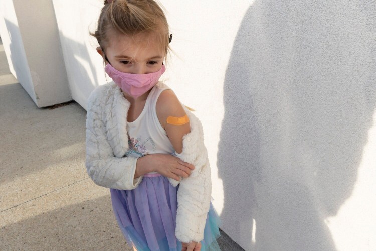 Julia Myles, 5, of Scarborough wore a sleeveless dress Thursday to get her first vaccination, at the Northern Light Home Care and Hospice clinic at the Maine Mall in South Portland. Appointments aren't necessary for the clinic, which will be open again on Saturday from 9 a.m. to 2 p.m.