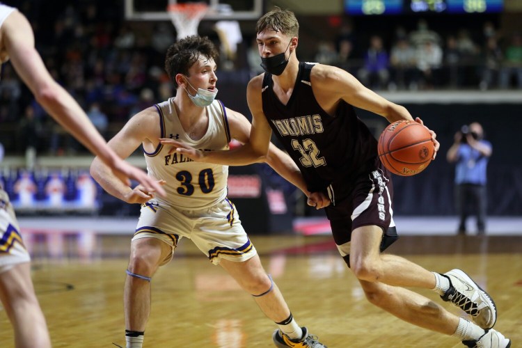 PORTLAND, ME - MARCH 5: Nokomis' Cooper Flagg maneuvers around Falmouth's Zach Morrill during the Class A state championship on Saturday at Cross Insurance Arena. (Staff photo by Ben McCanna/Staff Photographer)